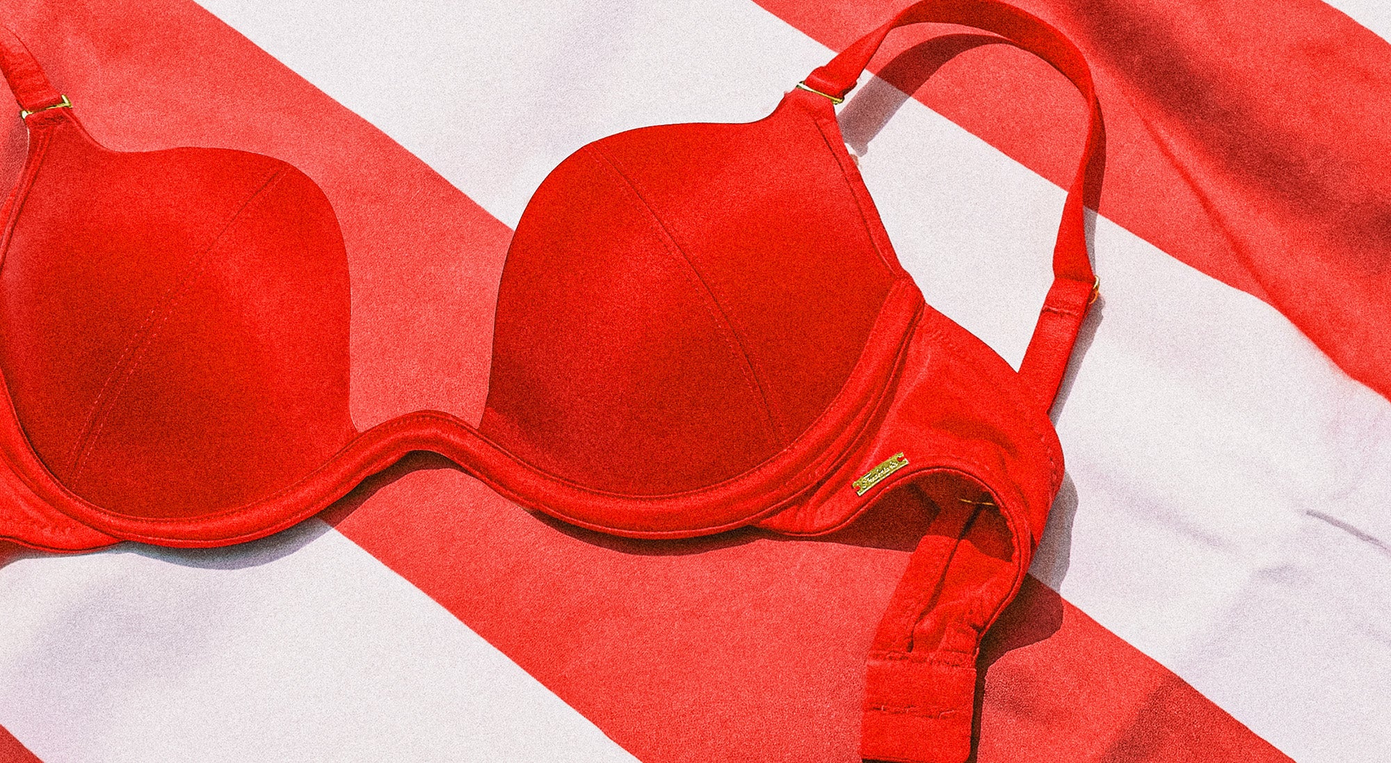 Red bra on a red and white striped background