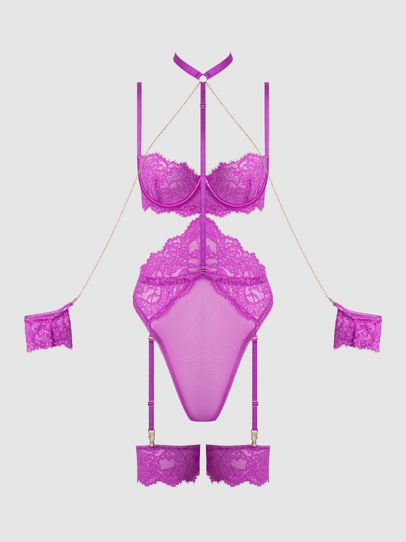 The Arianna Lace & Chains Thigh Garter Teddy by Frederick's of Hollywood features vibrant purple lace with chain accents, matching wrist and thigh cuffs, a mesh bodysuit, and strappy garters, arranged against a white background.