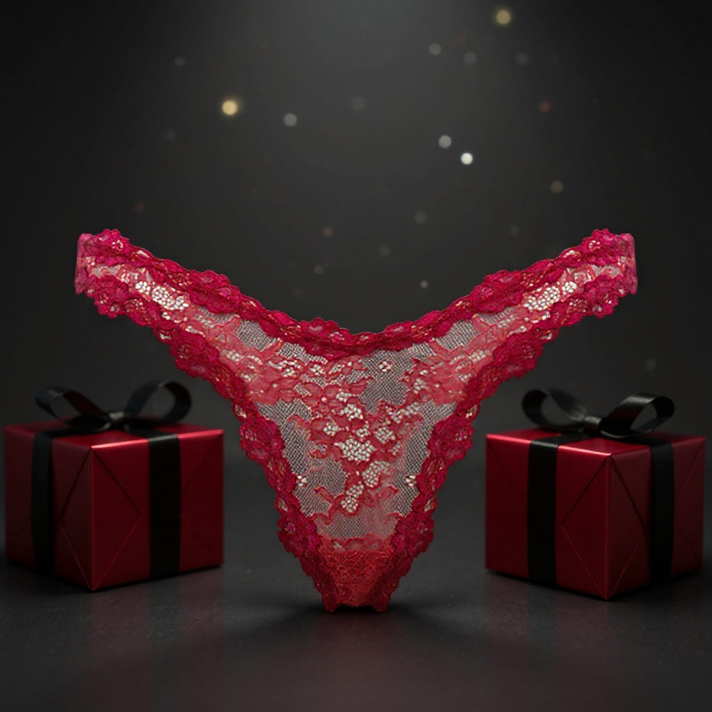 Red lace thong with two red gift boxes on a dark background