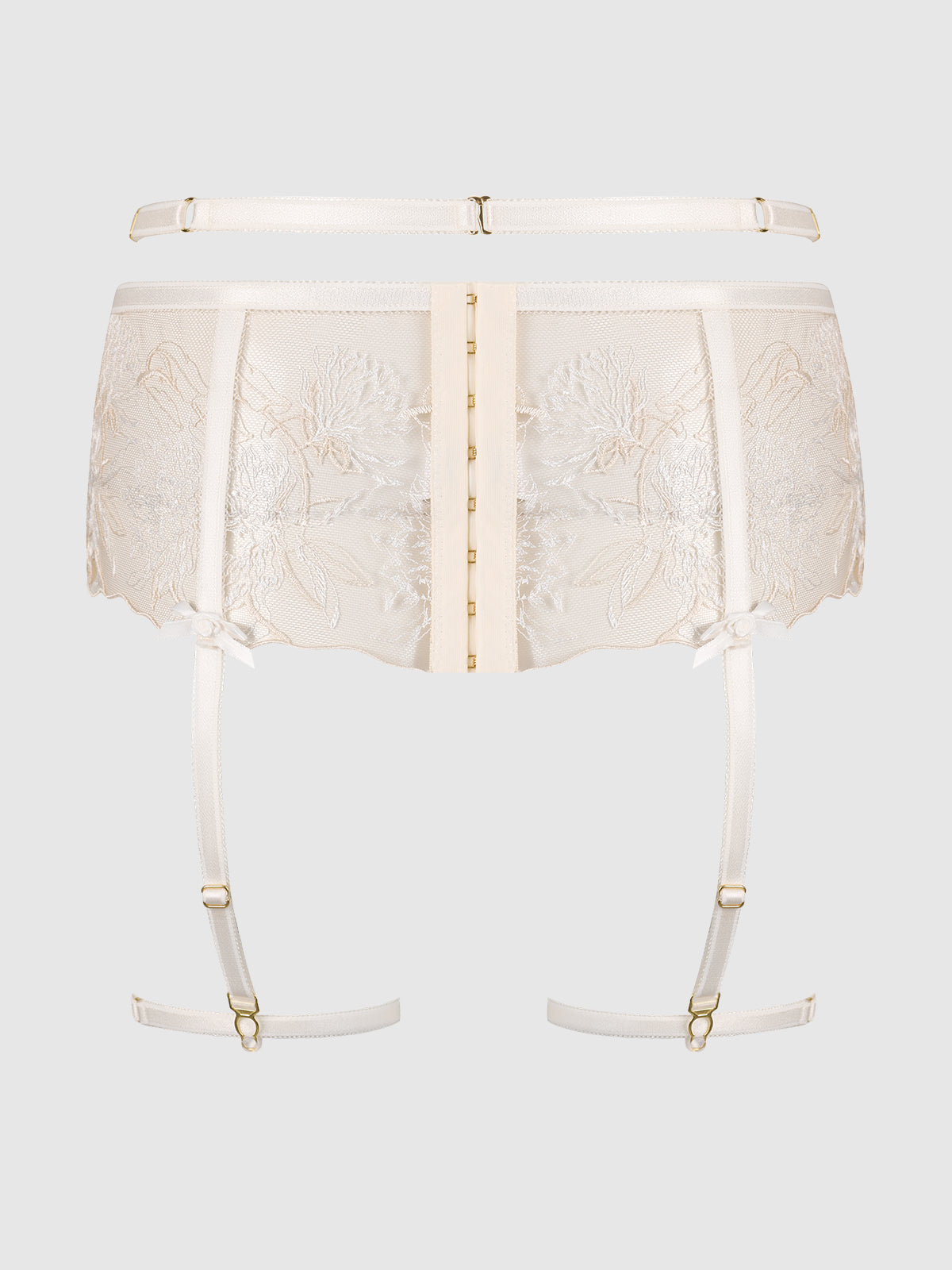 The Delfina Embroidered Garter Belt with Thigh Garters by Frederick's of Hollywood features sheer ivory floral lace, gold hook-and-eye front closure, adjustable garters, and satin ribbon accents, shown on a plain light gray background.