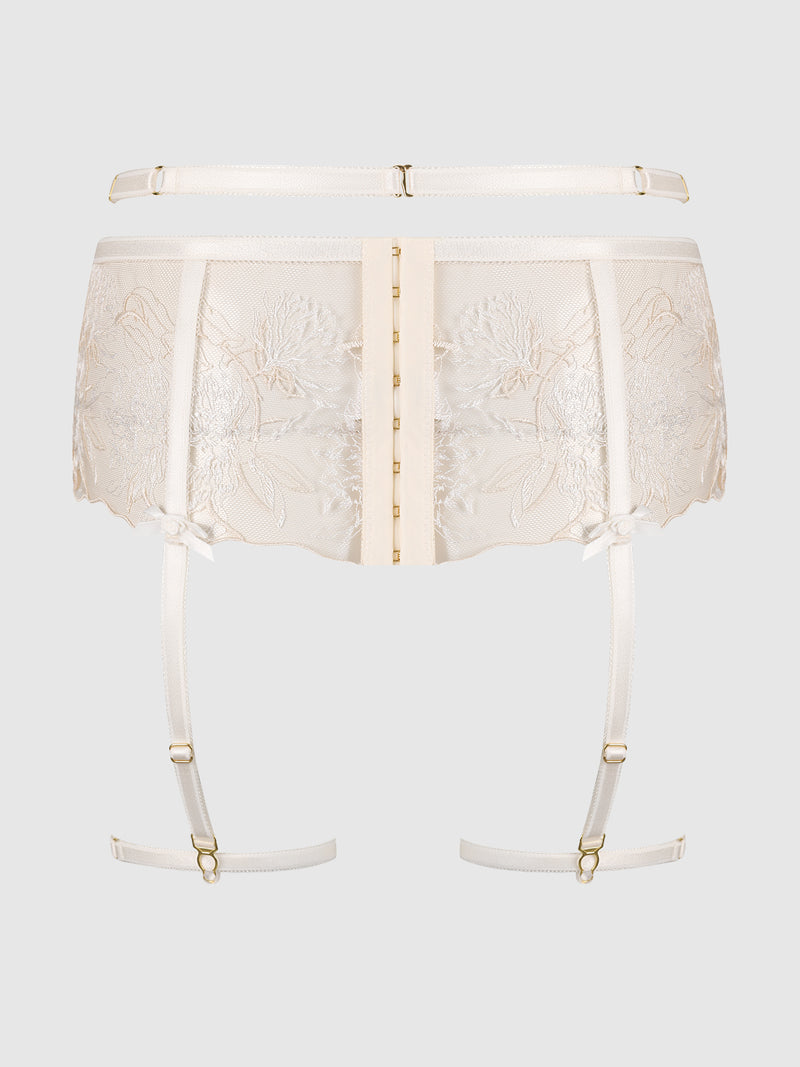 The Delfina Embroidered Garter Belt with Thigh Garters by Frederick's of Hollywood features sheer ivory floral lace, gold hook-and-eye front closure, adjustable garters, and satin ribbon accents, shown on a plain light gray background.