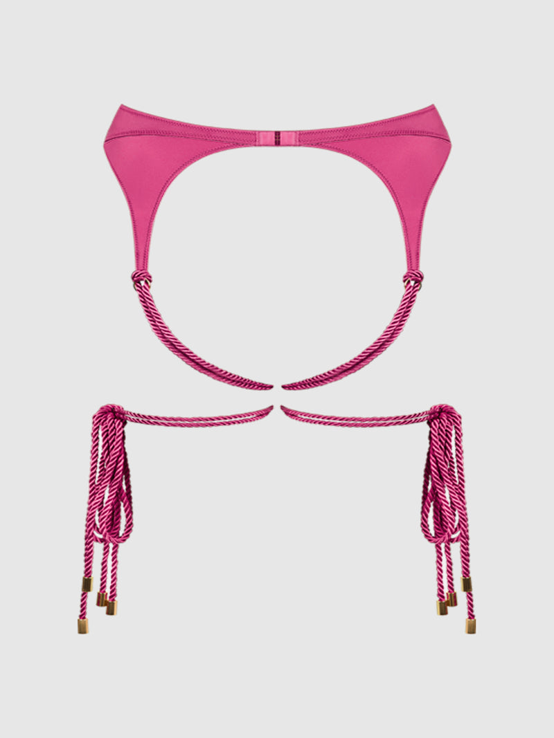 The Nadya Liquid Satin & Rope Garter by Frederick’s of Hollywood, in a vibrant pink with gold-tipped rope ties, is showcased against a plain white background.
