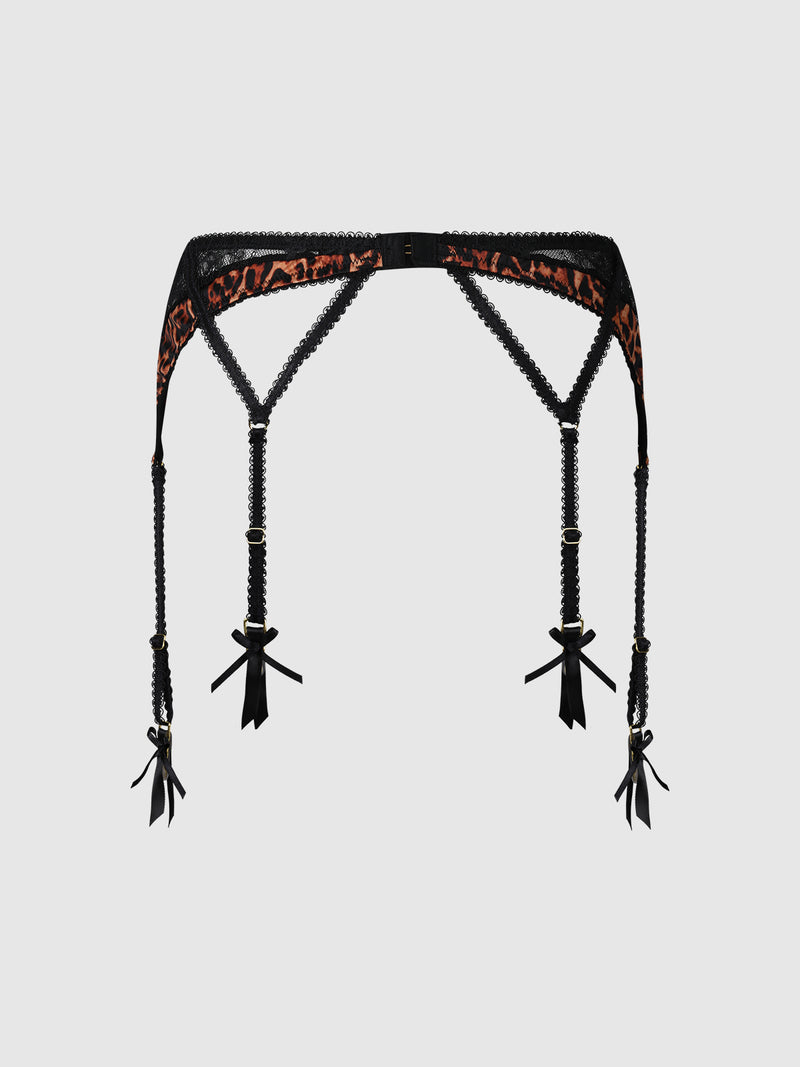 The Raven Leopard And Lace Garter by Frederick's of Hollywood features black lace and leopard print, with four adjustable straps each accented by small black satin bows, shown against a plain white background.