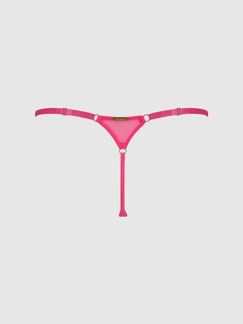 The Scarlett Mesh G-String by Frederick's of Hollywood features a vibrant pink hue, thin straps with gold hardware accents, and a front center vertical strap. It's displayed against a light gray background.