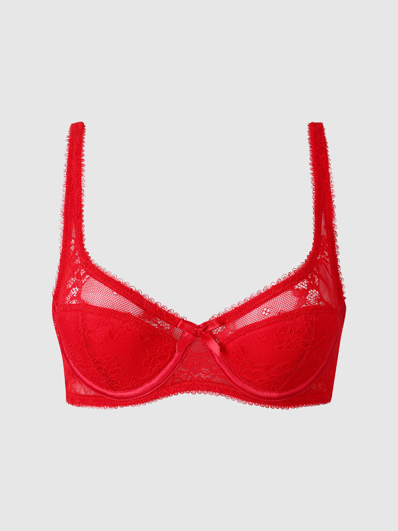 The Marilyn Monroe Lace & Satin Demi Bra by Frederick’s of Hollywood is a red underwire bra featuring sheer lace panels, decorative stitching, and a small satin bow in the center, displayed on a plain light background.