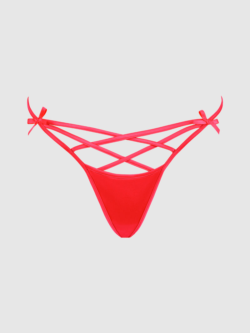 The Petra Heart Open Back Bikini by Frederick’s of Hollywood, featuring crisscross bands and small side bows in a red strappy design, is displayed on a plain light gray background.