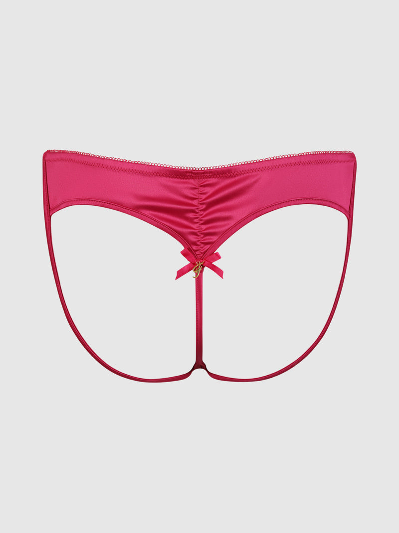 The Petra Heart Open Back Bikini by Frederick's of Hollywood is a bright pink, strappy thong with a ruched center and minimal fabric, accented by a small bow, shown on a plain white background.