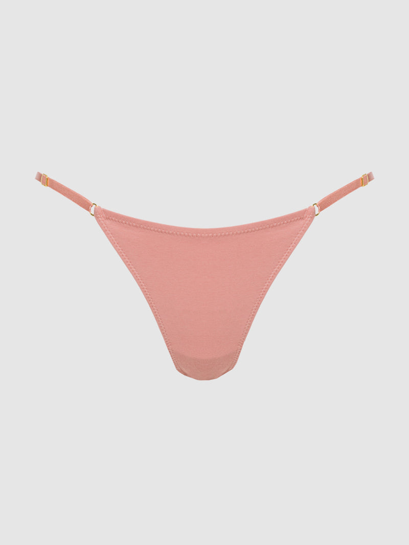 The Frederick's of Hollywood Bailey Stretch Cotton Bikini in blush pink features adjustable side straps for a custom fit, displayed against a plain light gray background.