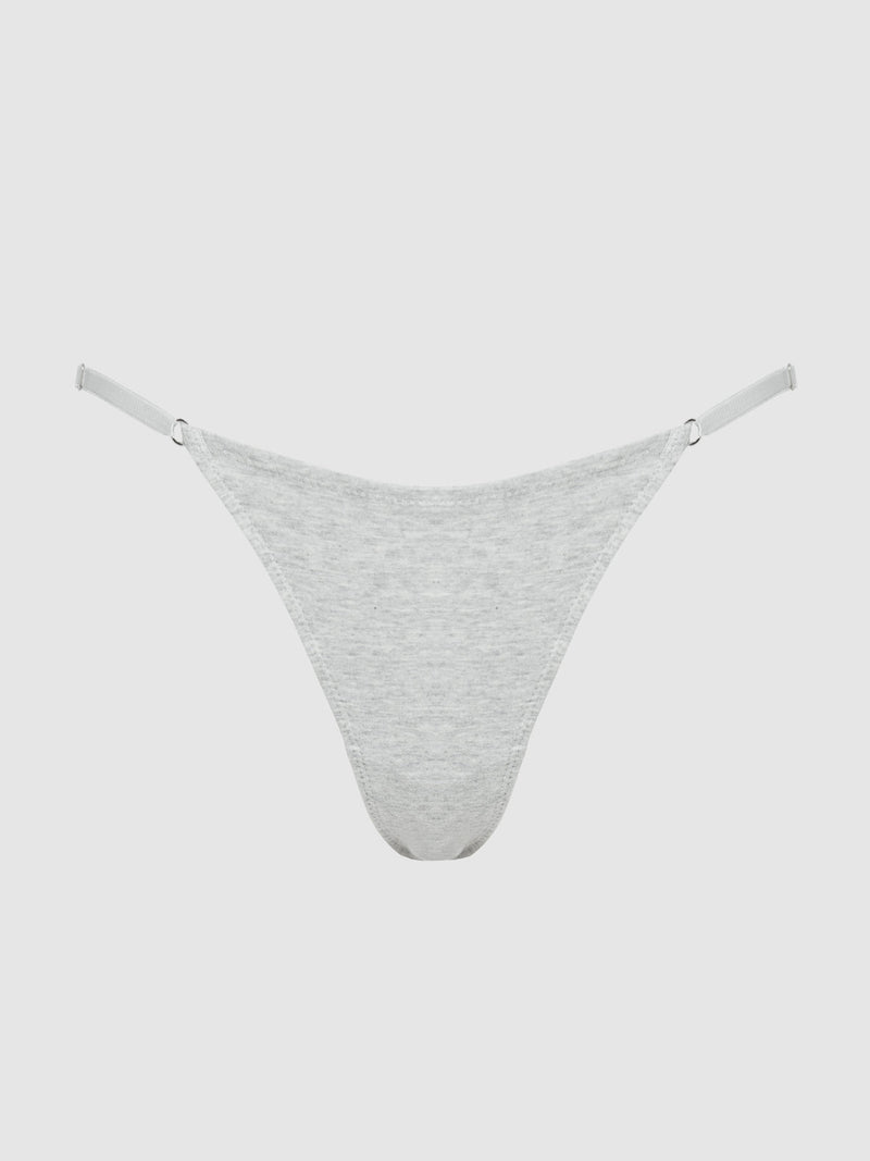The Bailey Stretch Cotton Bikini by Frederick's of Hollywood is a light gray, curve-hugging thong-style underwear with thin adjustable side straps, shown against a plain white background.