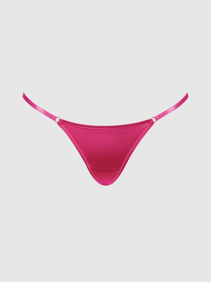 The Frederick’s of Hollywood Rising Star Liquid Satin Mini G-String features a vibrant pink hue, thin side straps, and gold ring accents, showcased against a simple light background.