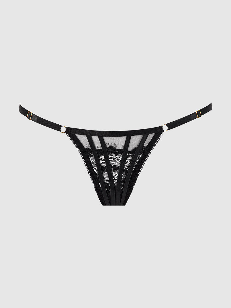 The Neev Lace G-String by Frederick's of Hollywood features sheer mesh panels, strappy details, and gold hardware accents, crafted from stretch lace and shown on a plain light grey background.