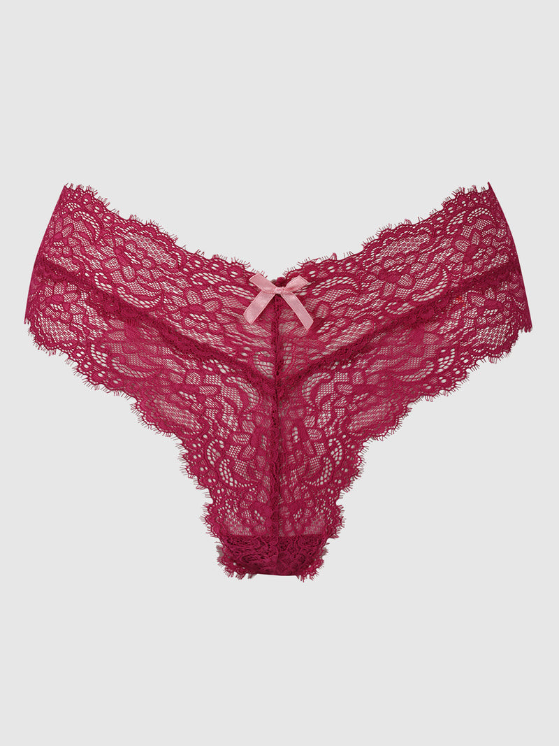 The Lulu Lace V Front G-String by Frederick's of Hollywood features deep red stretch lace with scalloped edges, minimal back coverage, and a petite pink satin bow at the center waistband, shown against a plain light background.