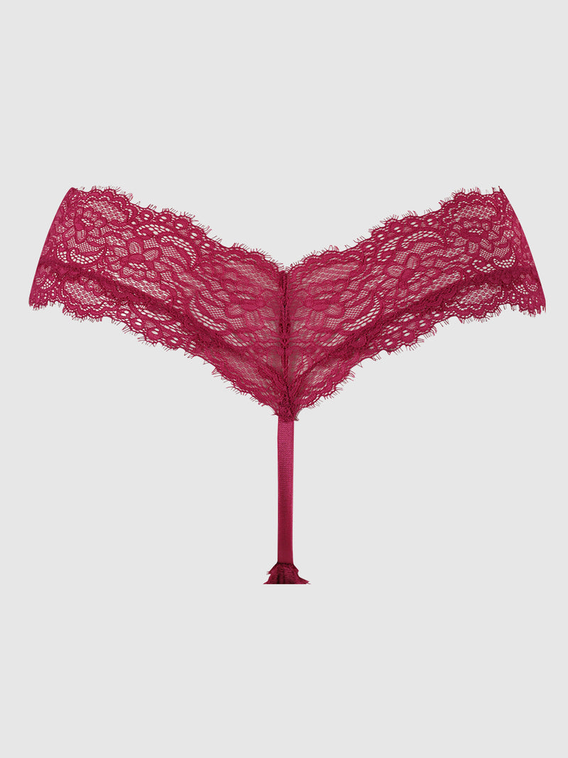 The Lulu Lace V Front G-String by Frederick's of Hollywood is a deep pink stretch lace panty featuring a V-shaped waistband, delicate floral pattern, and minimal back coverage, shown against a plain light gray background.