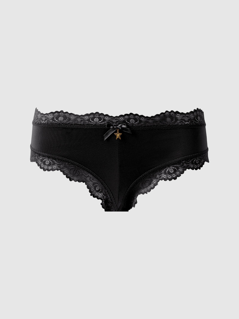 The Jenna Micro G-String by Frederick's of Hollywood features black lace trim, silky-soft microfiber, a small bow, and a gold star charm at the center front, shown on a plain light gray background.