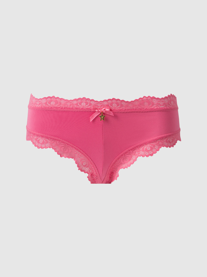 The Frederick's of Hollywood Jenna Micro G-String features bright pink, silky-soft fabric, lace trim, a scalloped edge, a center bow, and a star-shaped charm, shown against a plain light background.