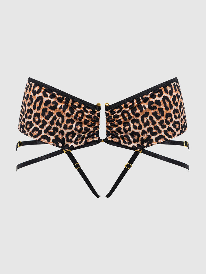 The Frederick's of Hollywood Raven Crotchless & Strappy U-Hook Panty is shown with a leopard print bandeau bra featuring black straps, gold-tone hardware, ruched center, and adjustable sides, all set against a plain white background.