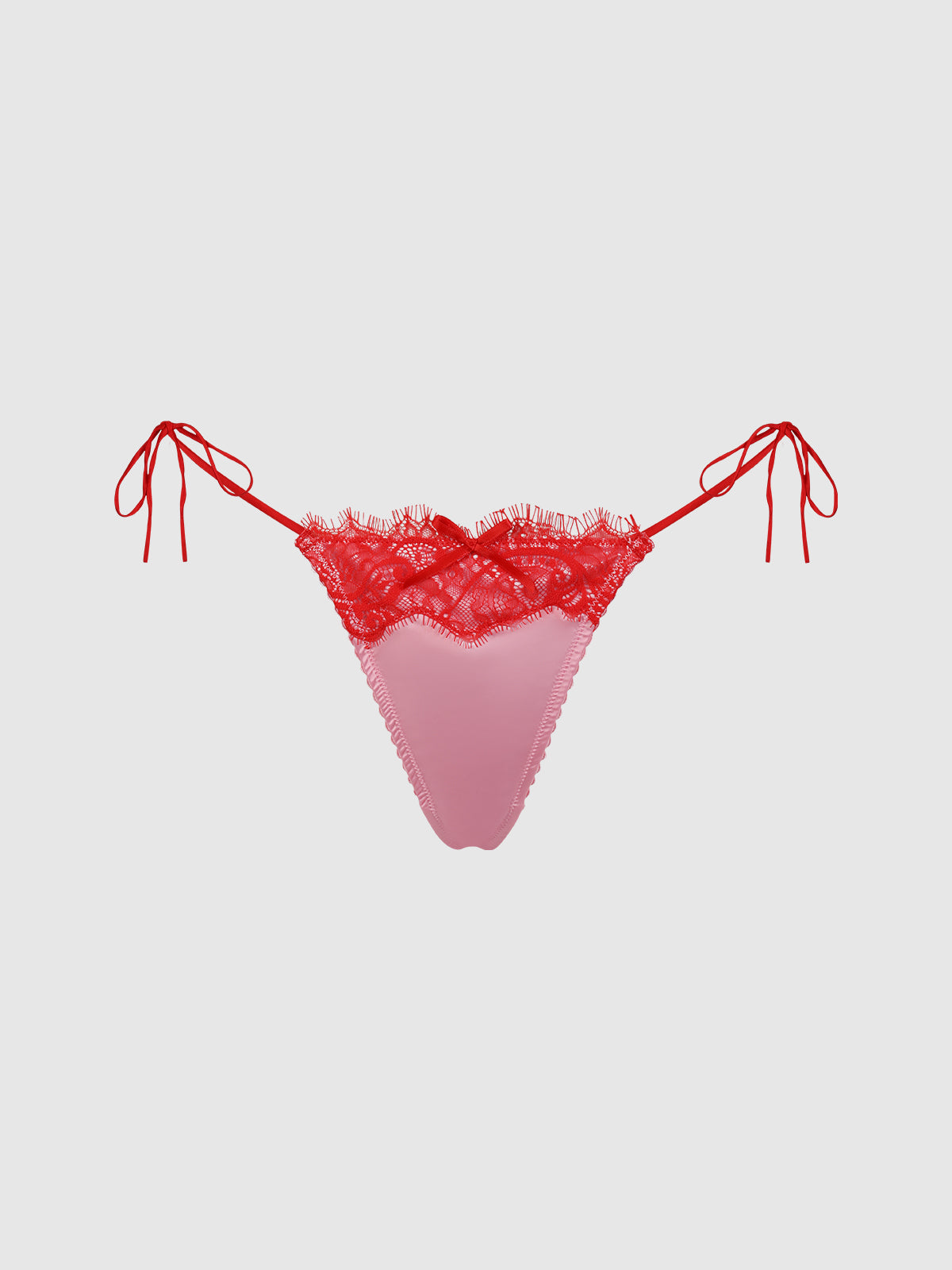The Rising Star Liquid Satin & Lace Tie Side Thong by Frederick's of Hollywood features pink satin, red lace trim, and side ties, displayed on a plain light background.