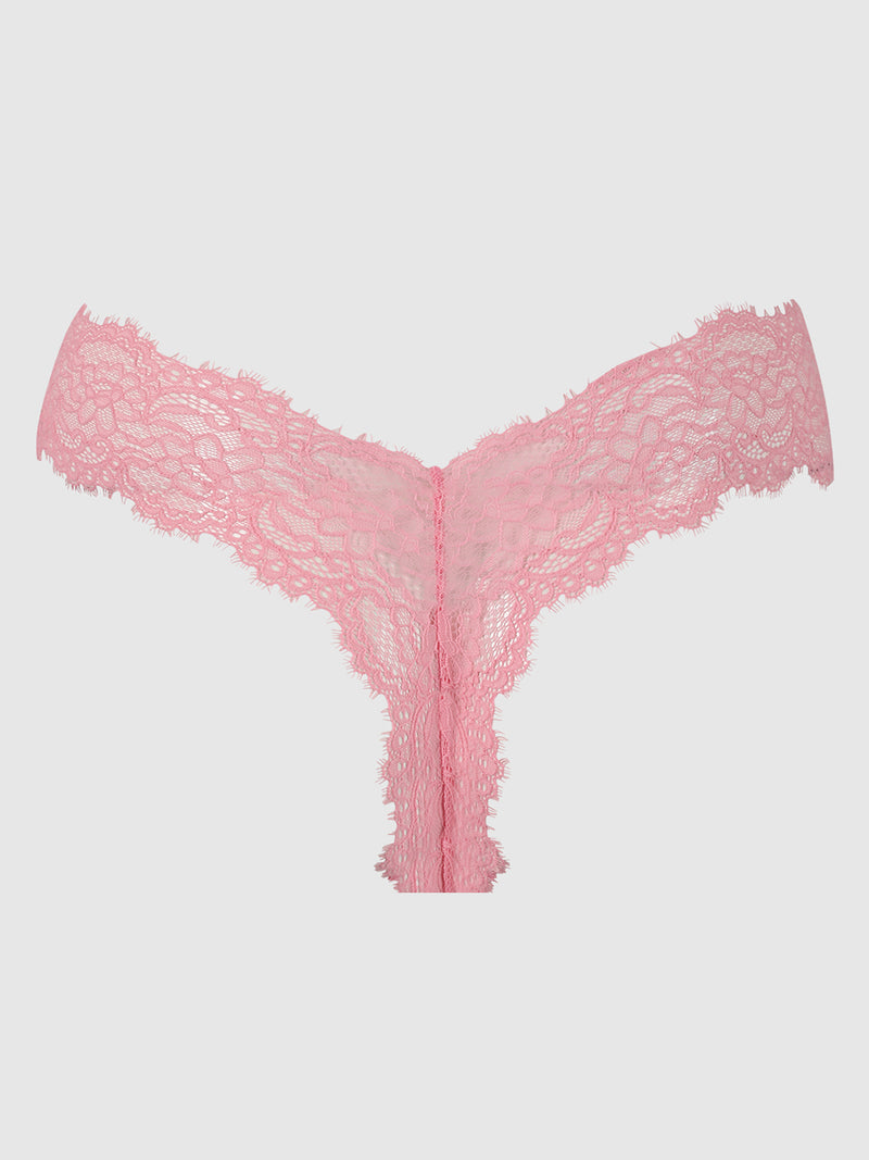 The Lulu Lace V-Thong by Frederick's of Hollywood features minimal back coverage and scalloped edges, shown in pink and displayed flat against a light gray background.