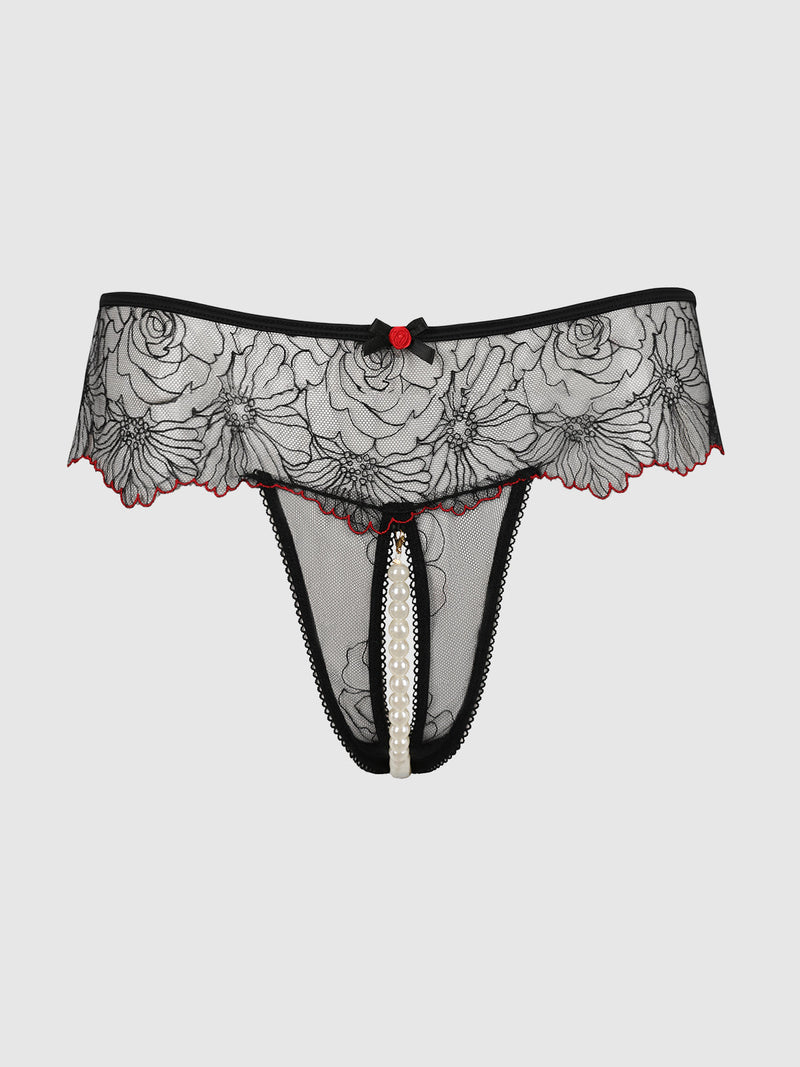 Ilaria Embroidered Tulle & Pearl Crotchless Thong in black tulle with red trim, a central red rose detail, and a vertical strand of faux pearls in the crotchless opening.