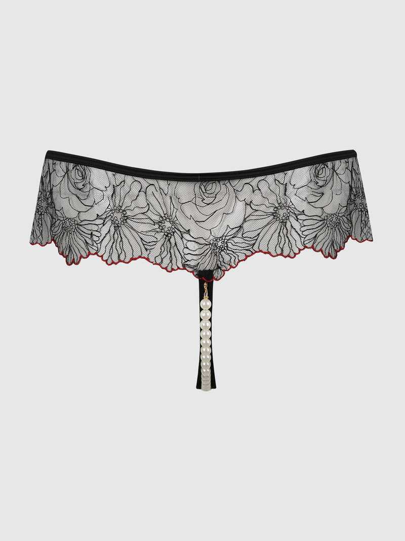 Ilaria Embroidered Tulle & Pearl Crotchless Thong in black floral embroidered tulle, featuring a string of pearls down the front and a red scalloped hem.