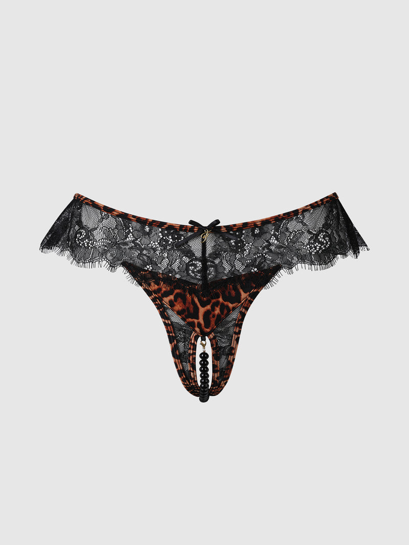 The Raven Leopard And Lace Crotchless Pearl Thong by Frederick's of Hollywood features a bold lace and leopard print design with black beaded pearl detailing and a dainty bow accent, displayed on a plain white background.