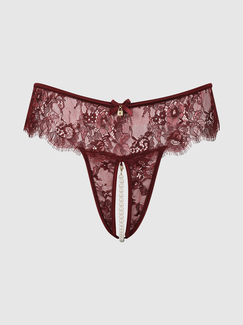 Lilith Lace & Pearl Crotchless Thong in burgundy lace, featuring a small gold-toned heart lock charm at the waist and a vertical strand of faux pearls.