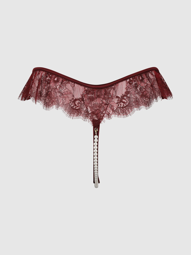 Lilith Lace & Pearl Crotchless Thong in burgundy lace with a single strand of white pearls hanging from the center front.