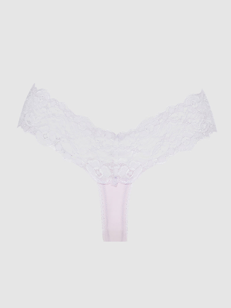 The Bridget Stretch Cotton & Lace Thong by Frederick's of Hollywood, in white, is the perfect addition to your intimate basics collection—shown against a light gray background.