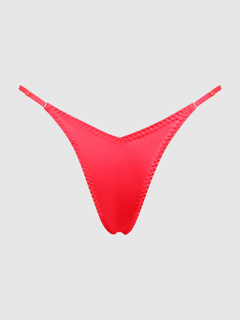 The Petra Slider Side Satin Thong by Frederick’s of Hollywood, a vibrant red women’s thong with slim side straps, is displayed on a plain light gray background.