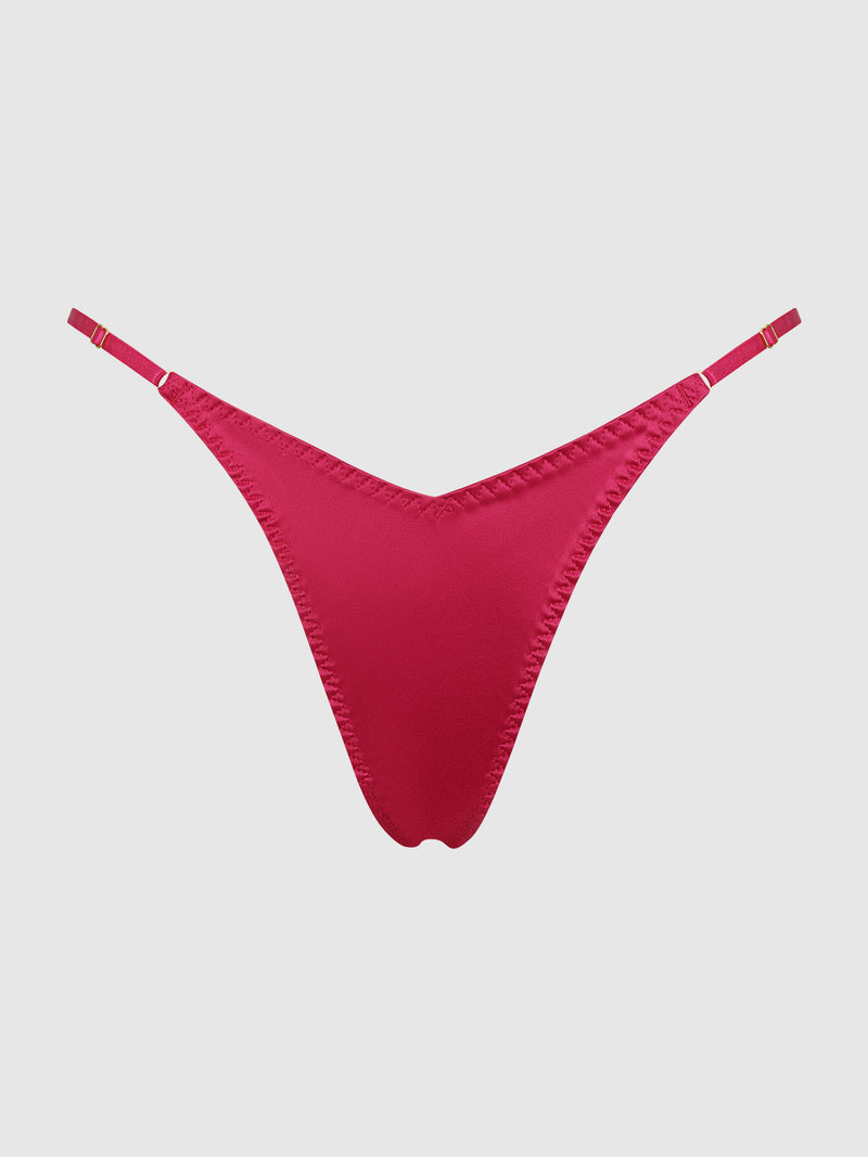 The Frederick's of Hollywood Petra Slider Side Satin Thong in bright red features thin adjustable side straps, displayed on a plain light gray background.