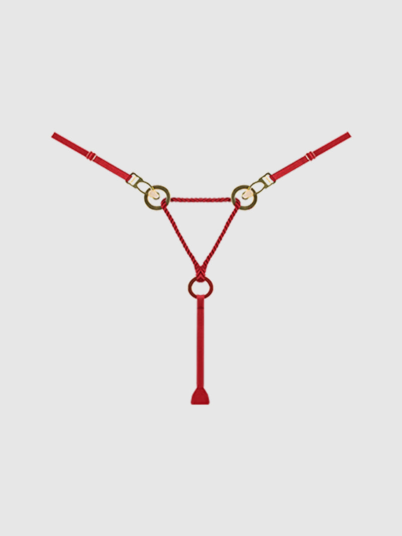The Nadya Liquid Satin & Rope Thong by Frederick's of Hollywood features red satin straps with gold rings in a triangular design and tassel detail, displayed on a plain light gray background.