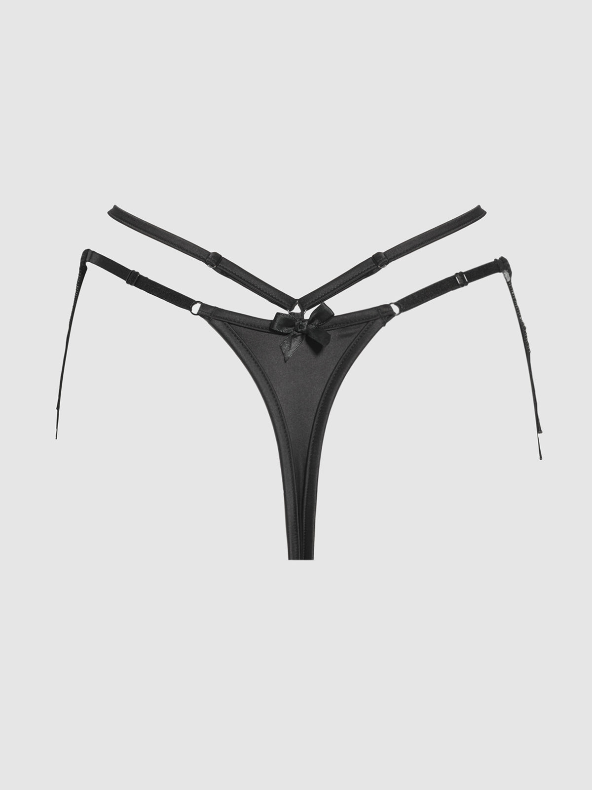 The Lune Beaded & Strappy Thong by Frederick's of Hollywood features adjustable straps, a central mesh panel, and a decorative front bow, shown here in black on a plain light background.
