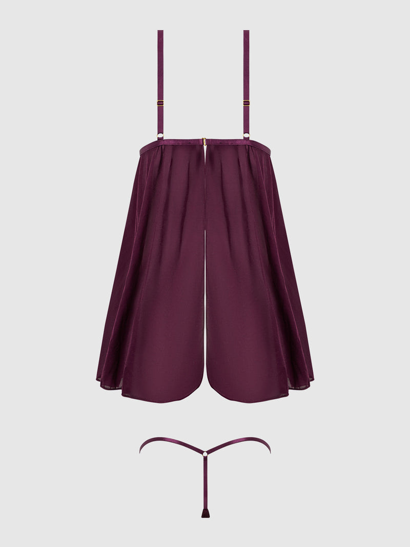 The Frederick's of Hollywood Pia Shine Mesh O-Ring Open Cup Babydoll Set features a burgundy sheer flowing top with rhinestone O-ring accents, adjustable straps, front slit, and a minimal matching thong, shown on a plain light background.