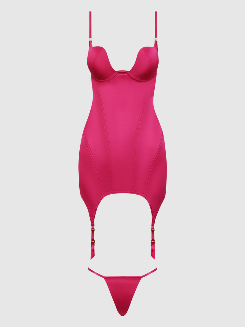 The Frederick's of Hollywood Rising Star Plunge Open Back Chemise Set in Petra Satin features a vibrant pink satin chemise with underwire cups, adjustable straps, garter straps, and a matching thong, displayed on a plain light background.