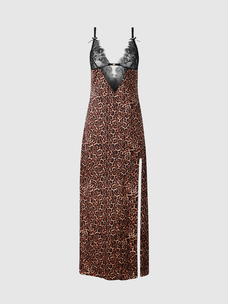 The Raven Leopard And Lace Gown With Side Slip by Frederick's of Hollywood features a long silhouette with a black lace top, thin straps, and a plunging V neckline. The skirt showcases a brown and black leopard print accented by a white vertical stripe near the hem on one side.