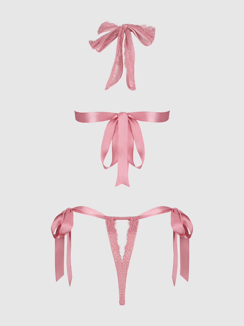 The Rosalind Satin & Lace Drop Off Crotchless Teddy by Frederick's of Hollywood features ribbon bows, an open back, a lace eye mask, satin waist belt, and thong with side ties, all shown on a plain white background.