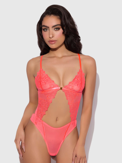 A woman poses against a plain background wearing the Frederick's of Hollywood Wren Embroidered Wireless Teddy, featuring lace, satin, thin straps, and cut-out details.