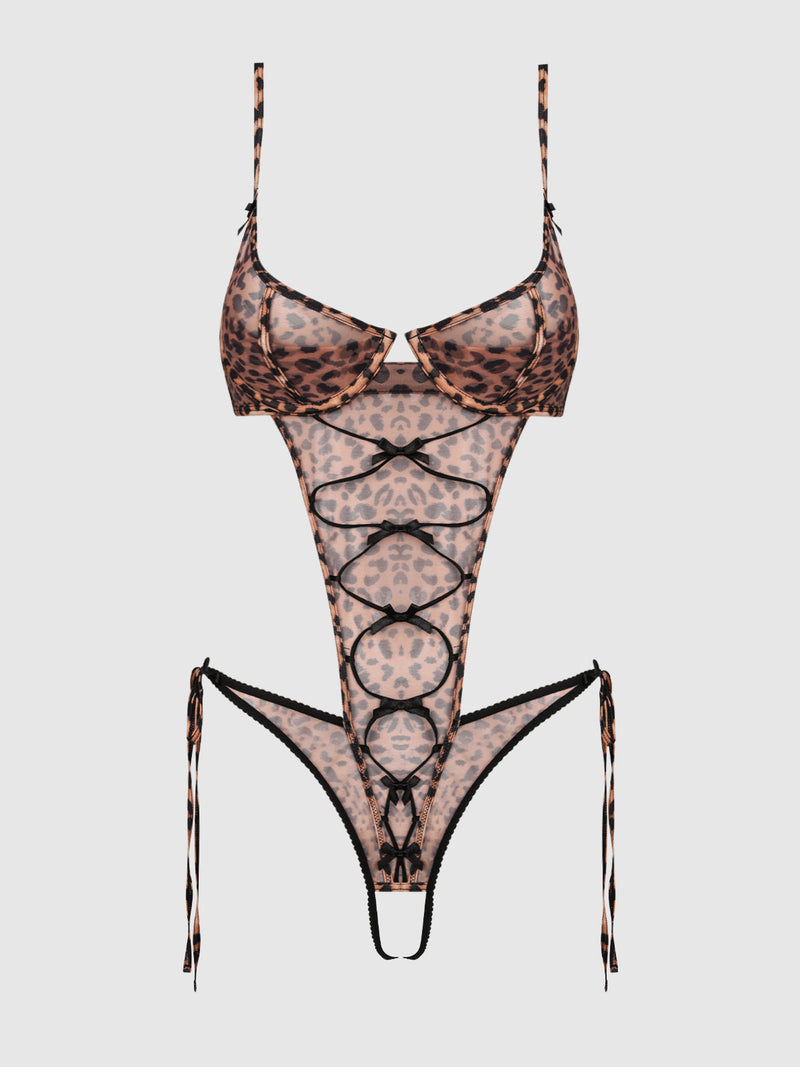 The Kaia Leopard Mesh Crotchless Teddy from Frederick's of Hollywood features sheer leopard print, lace-up front detailing, thin adjustable straps, and high-cut sides tied with strings.