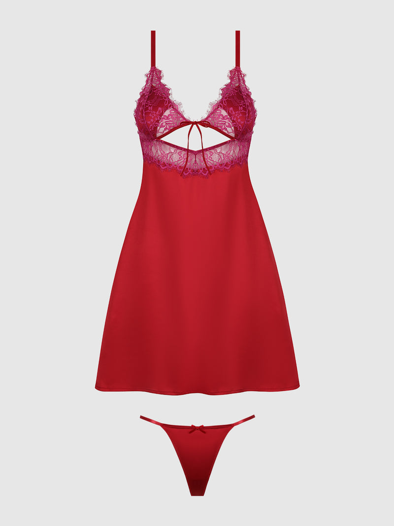 The Rosalind Babydoll Set by Frederick's of Hollywood features a red and purple lace and satin sleeveless short nightdress with a keyhole cutout and bow, paired with matching g-string underwear, displayed on a plain background.