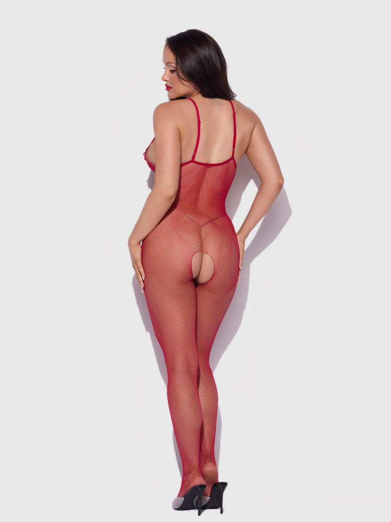 A woman wearing the Frederick’s of Hollywood Crotchless Lace & Fishnet Full Length Bodystocking paired with high heels stands facing away against a plain white background.