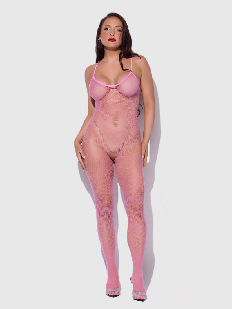 A person wearing a neon pink Frederick’s of Hollywood Crotchless Fishnet Full Length Bodystocking, featuring a full-length design with spaghetti straps.