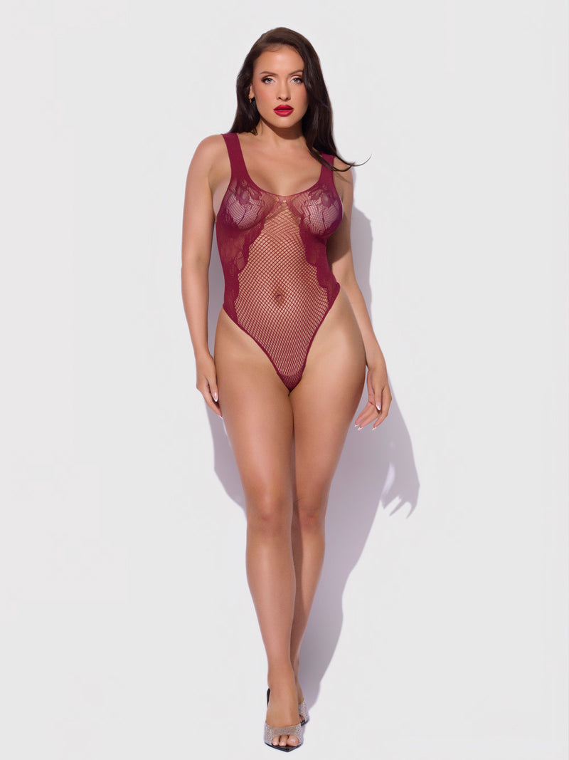A woman wears a burgundy Lace & Fishnet Teddy Bodystocking made of lace and fishnet.