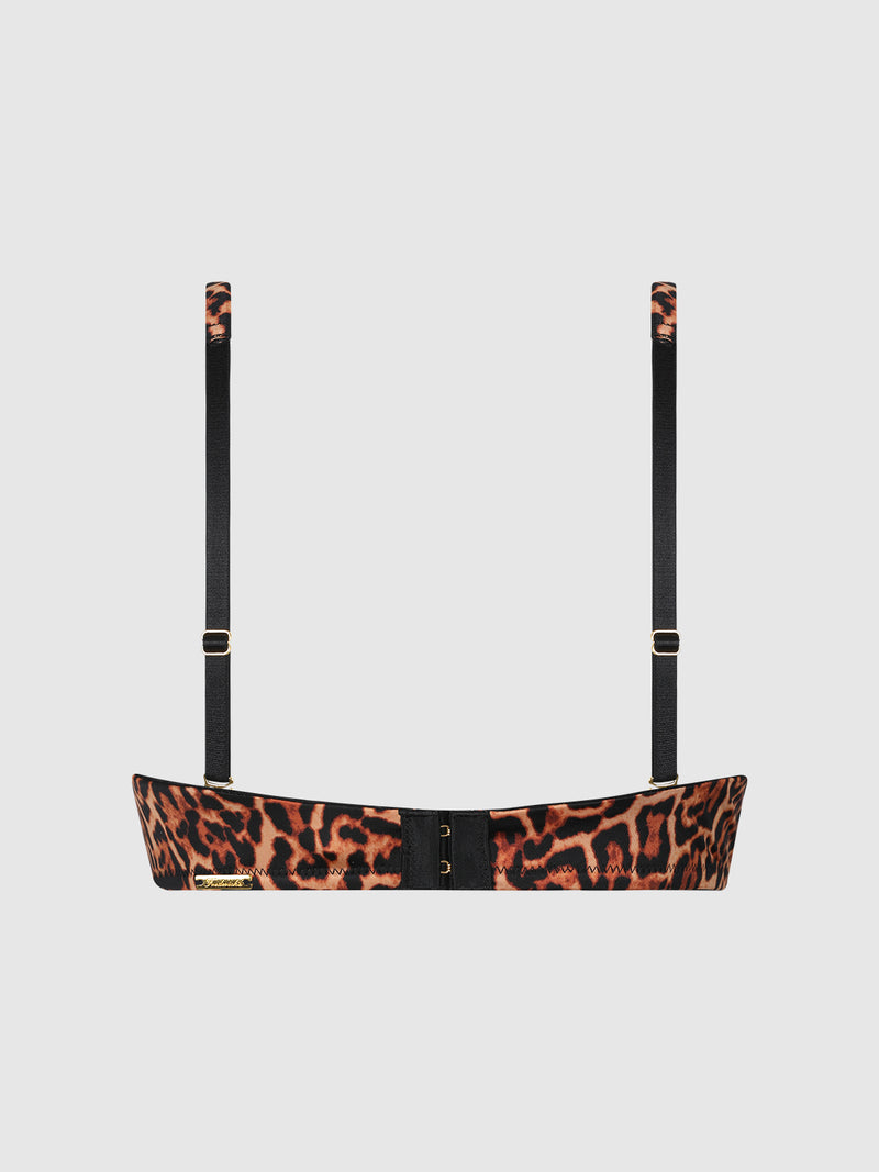 The Rising Star Swirl Plunge Push Up Bra by Frederick's of Hollywood features a leopard print, black adjustable straps, and gold hardware, displayed from the back against a plain white background.