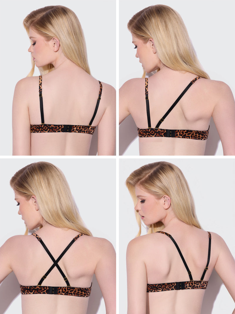 A woman with blonde hair models the Frederick's of Hollywood Rising Star Swirl Plunge Push Up Bra, featuring a leopard-print design and adjustable black convertible straps, shown from the back and side with the straps styled both parallel and criss-cross against a plain background.