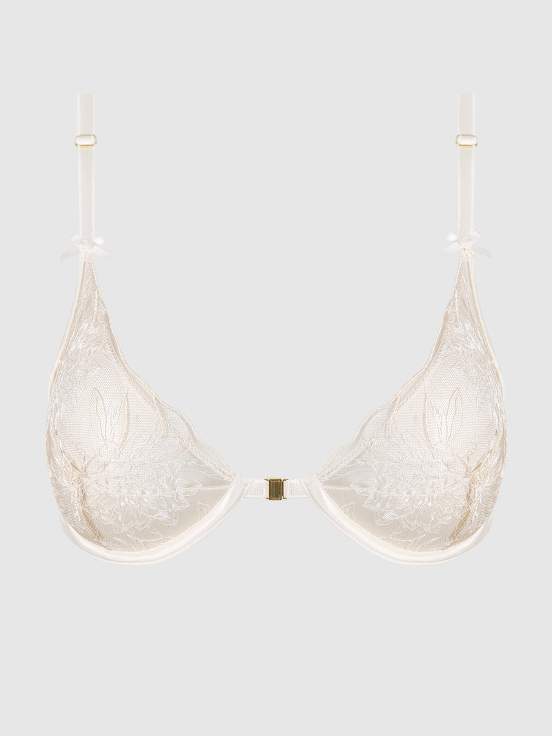 The Delfina Embroidered Push Up Half Cup Bra by Frederick's of Hollywood features sheer white lace, floral embroidery, adjustable straps, and a front clasp, shown on a plain light gray background.