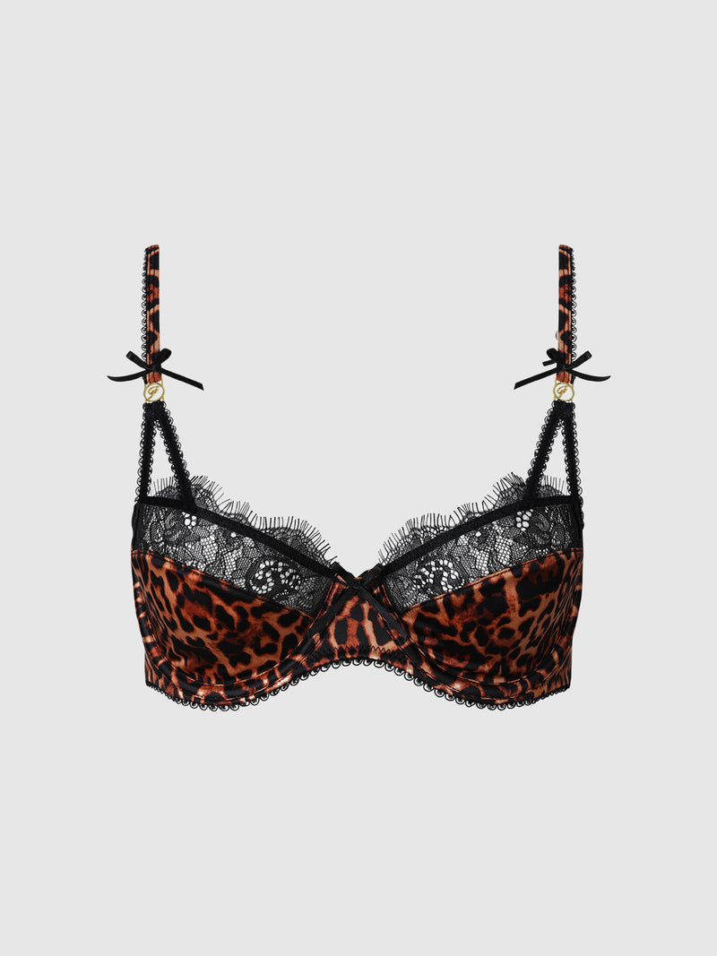 The Raven Leopard And Lace Bra by Frederick's of Hollywood features a striking leopard print with black lace trim, accented by small black bows and gold details on the straps, showcased against a plain white background.