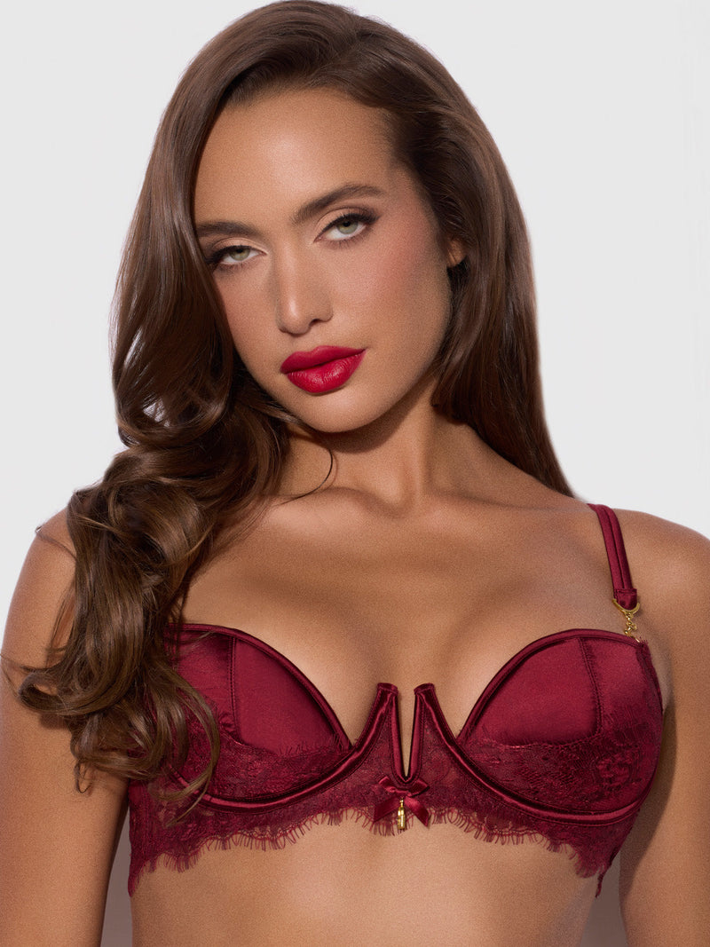 A person wearing a dark red Lilith Lace & Mesh V Wire Bra with lace trim.