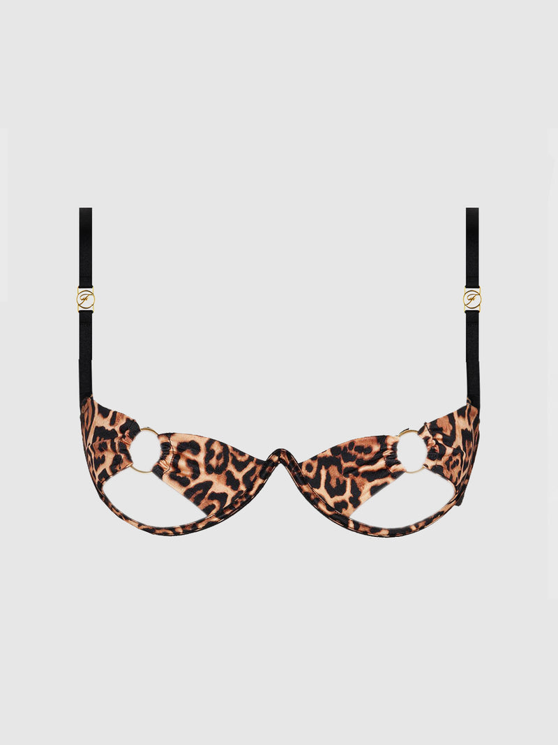The Raven O-Ring Open Cup Bra by Frederick’s of Hollywood commands attention with its daring leopard print, black adjustable straps, gold hardware, and striking cut-out cup details. Showcased against a plain white background, this open-cup bra embodies bold confidence and modern allure.
