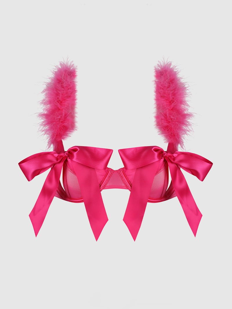 The Scarlett Marabou & Mesh Openable Cup Bra by Frederick's of Hollywood features bright pink satin, large bows, and fluffy feather trim on the straps for a sculpted bustline, shown against a plain light background.
