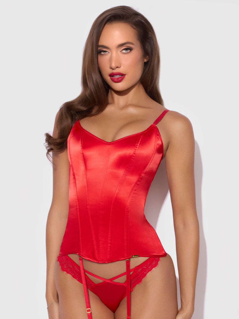 A person wears a red satin Iconic Full Boning Scoop Neck Corset and matching lace-trimmed thong with garter straps.